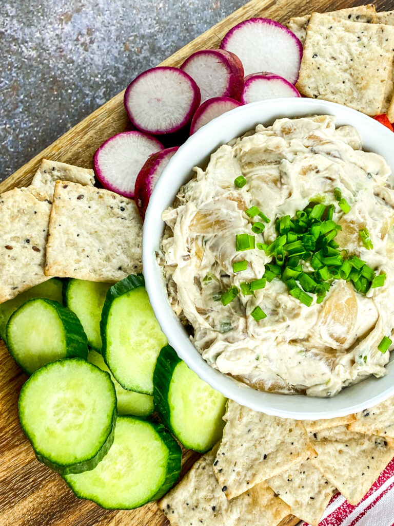 A picture of caramelized onion dip in a white bowl.