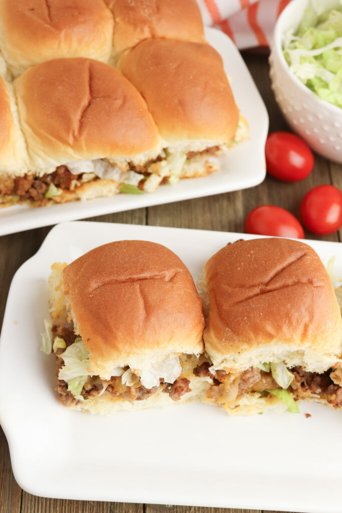 A picture of two taco sandwich sliders on a plate. roundup