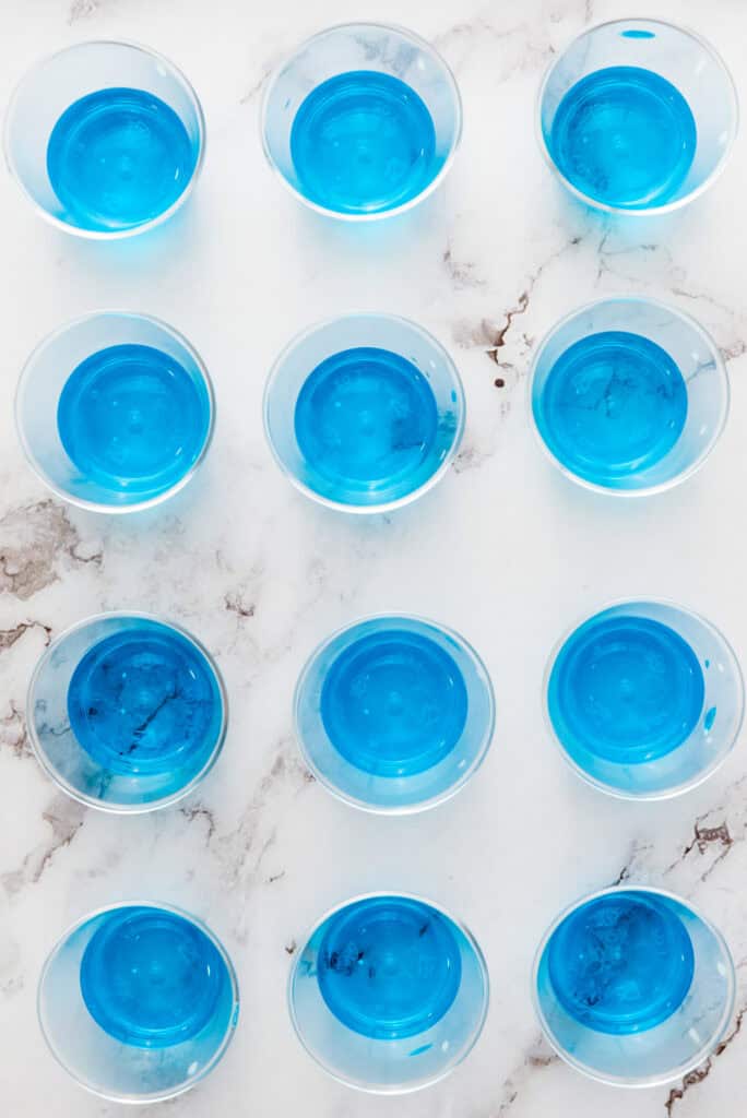 blue jello cups in shot glasses.