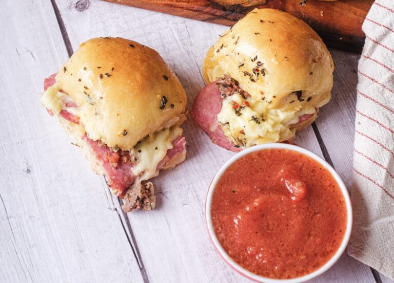 2 cheesy pizza sliders with a dip on the side