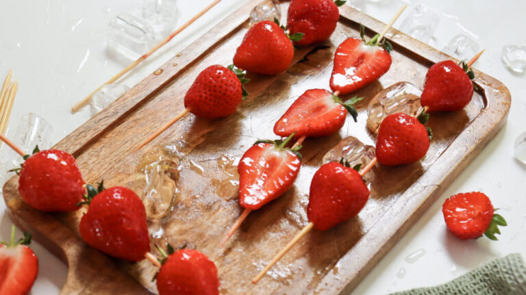 sweet strawberries on skewers with ice