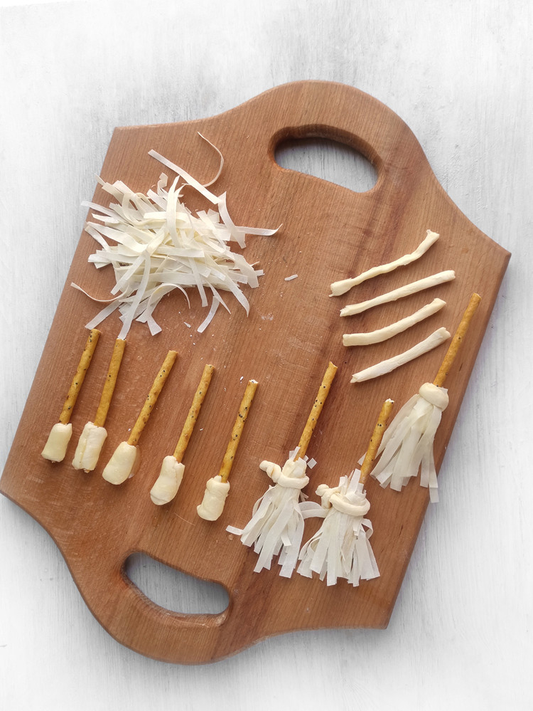 Witch's brromsticks on a cuting board.