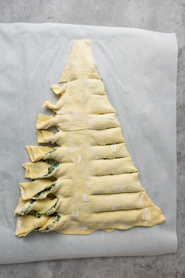 puff pastry triangle with slits cut on both sides twisted into branches