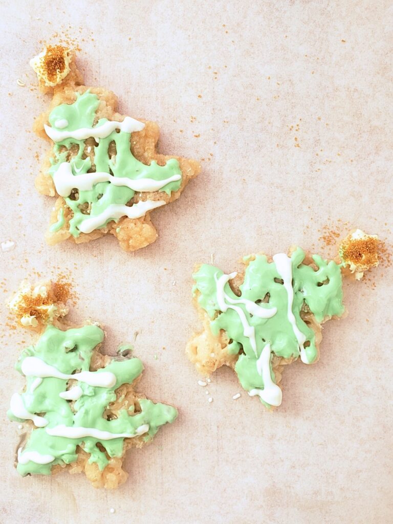 christmas tree rice krispies decorated light green, white and yellow with gold sprinkles