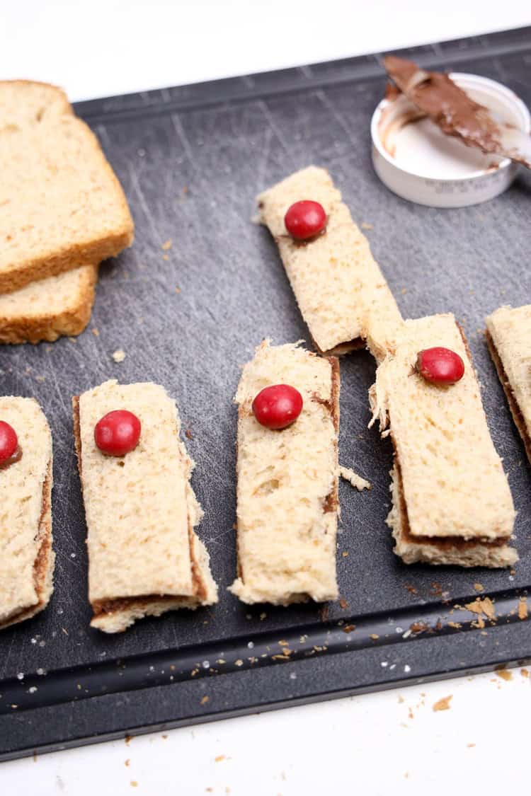 noses dipped in nutella and placed on sandwich rectangles