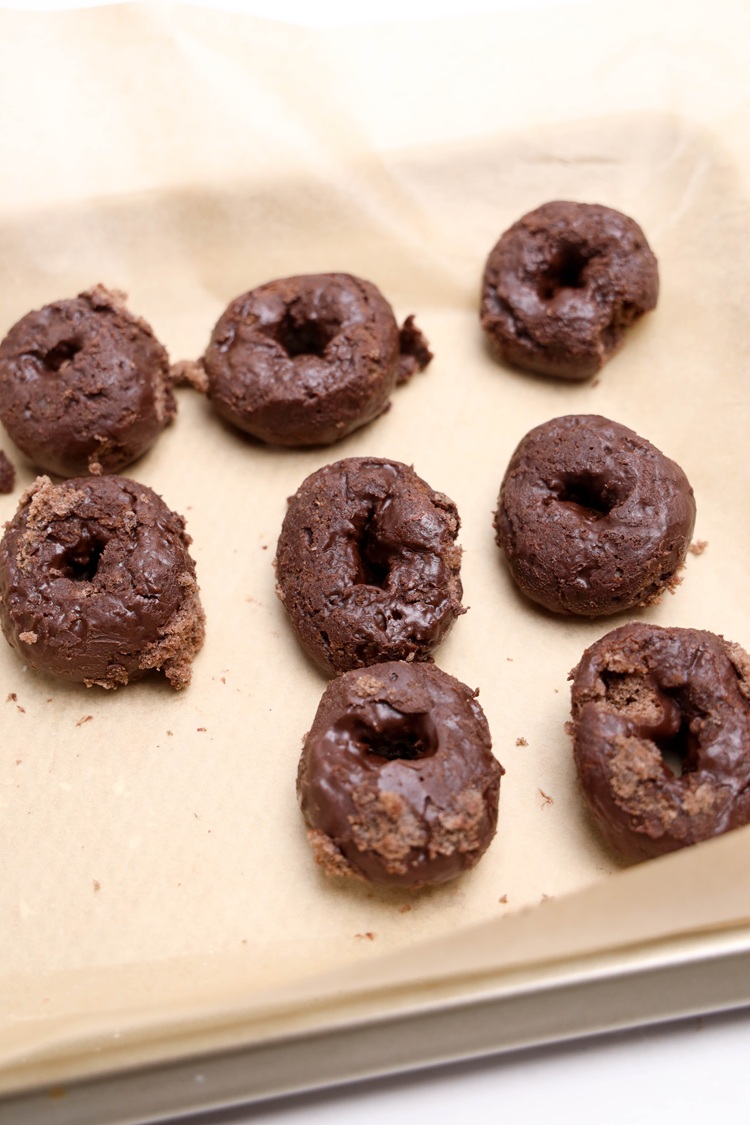 donuts on parchment paper