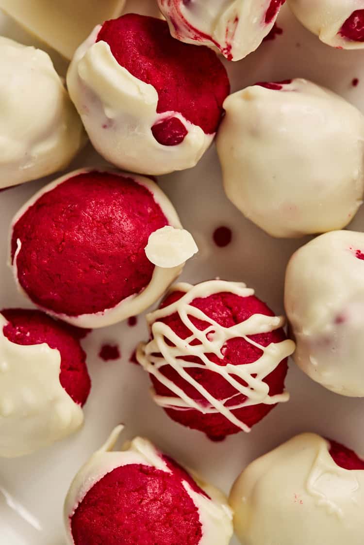 A close up picture of frosted red velvet truffles.