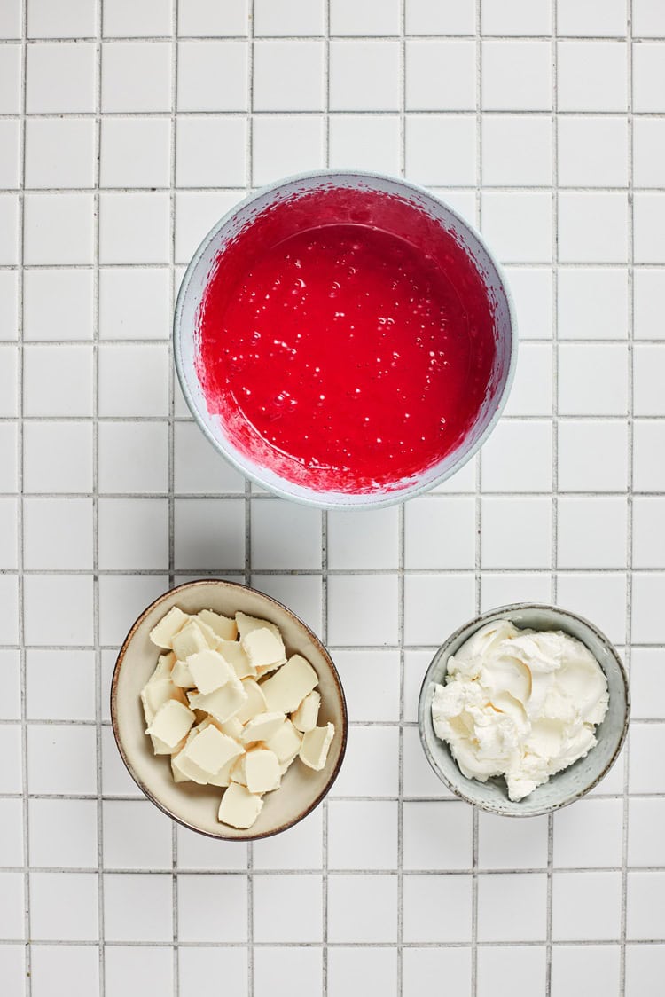 A picture of a bowl of mixed red velvet cake batter.
