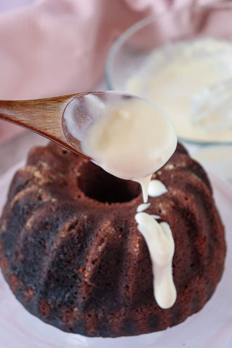 A picture of a bundt cake being frosted.