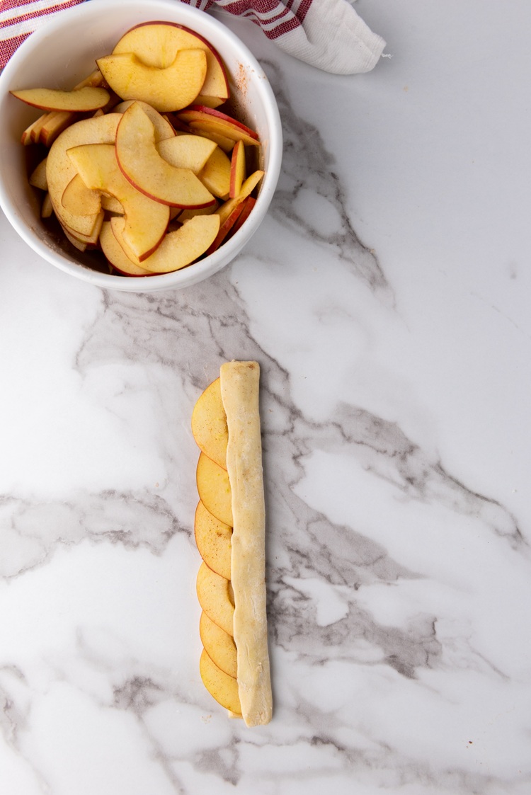 A picture of a puff pastry slice being folded.