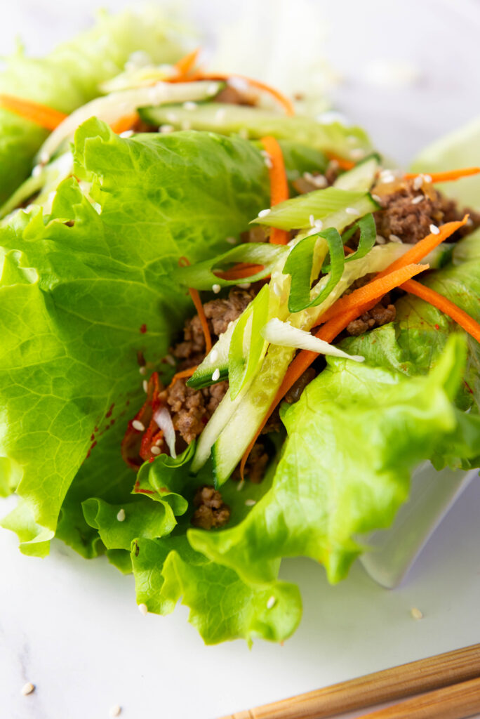 A zoomed in picture of a korean beef lettuce wrap.