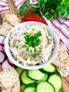 A close up picture of a bowl of caramelized onion dip.