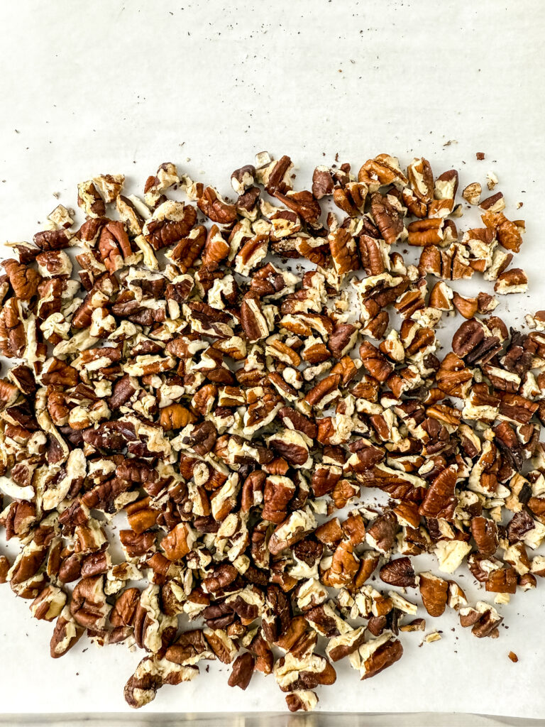 A picture of a pile of chopped pecans.