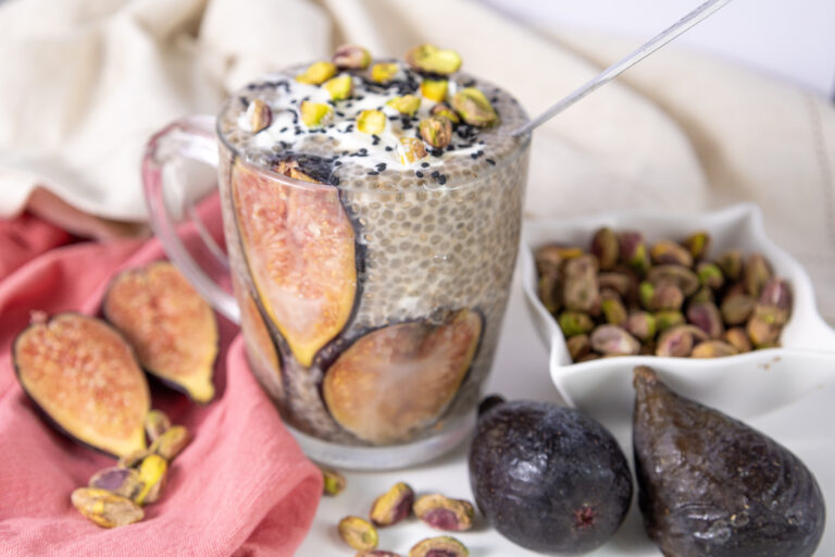 A picture of chia udding with figs in a glass mug.