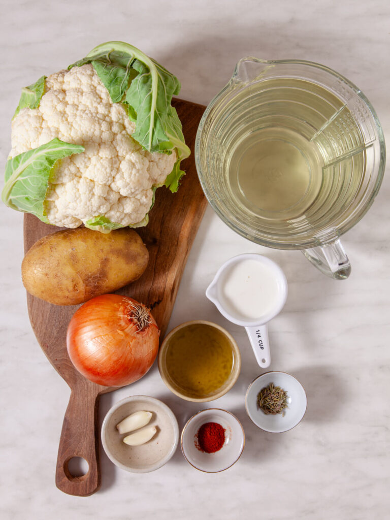 A picture of ingredients to cook creamy cauliflower soup.