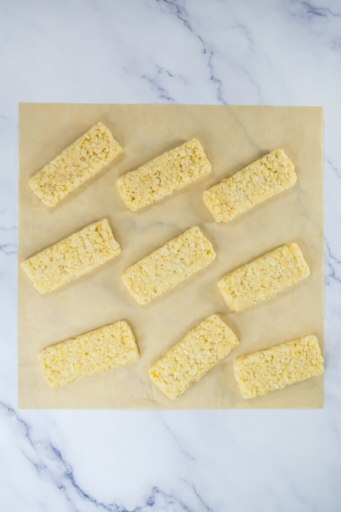 A picture of rice krispy treats shaped into rectangles.