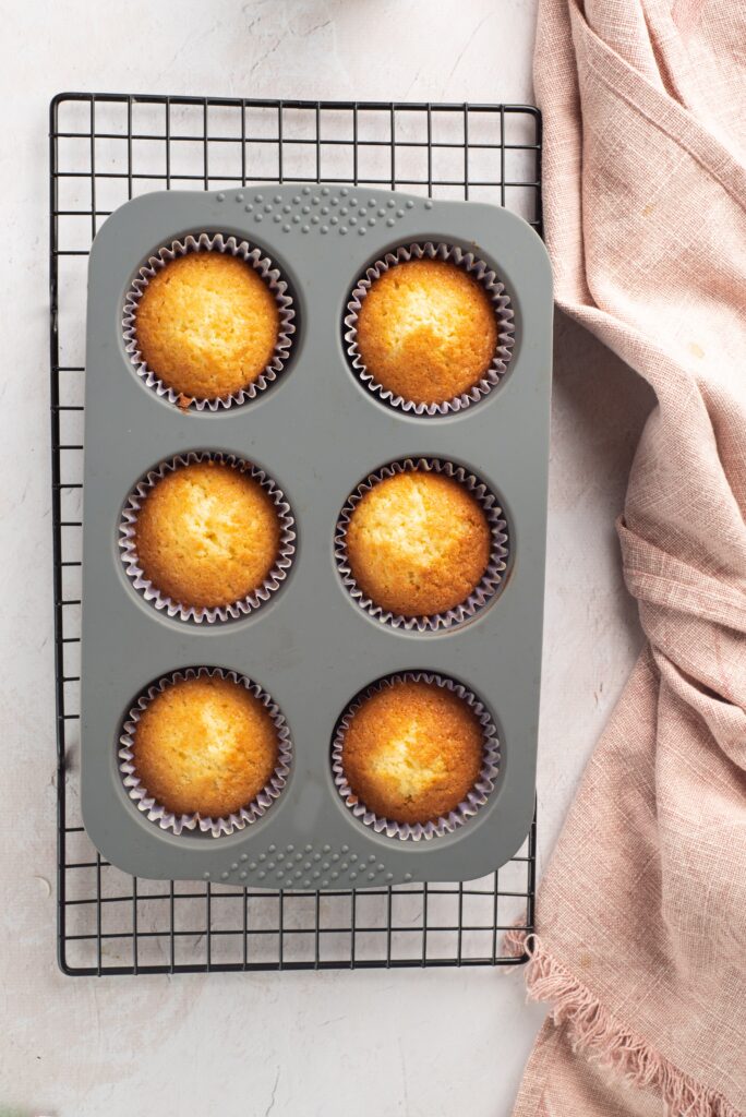 baked easter cupcakes cooling off after coming out of the oven