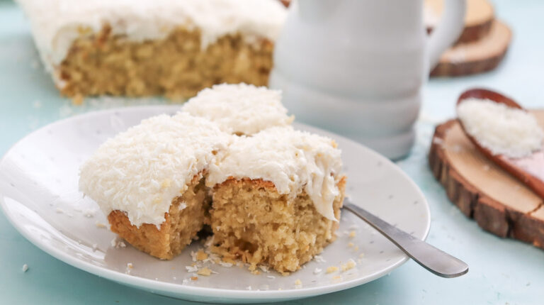 A picture of three slices of fluffy coconut cake.