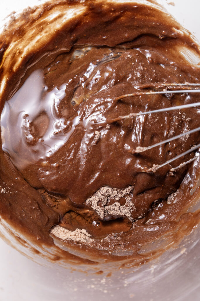A picture of cake mix whisked with water, oil, and egg.