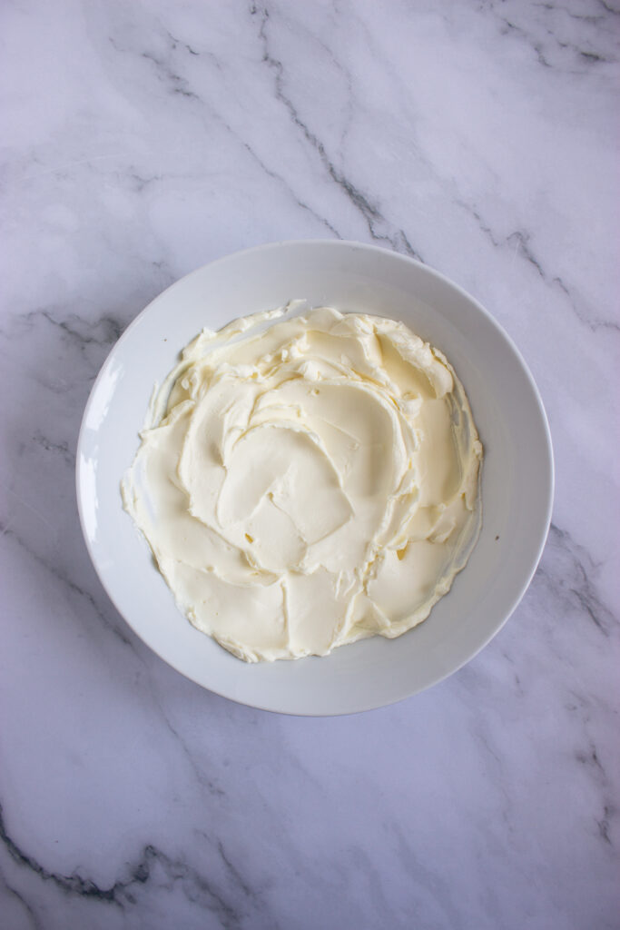 A picture of whipped cream cheese in a bowl.