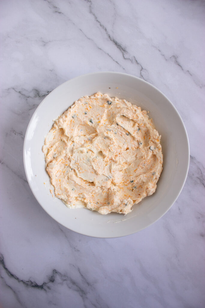 A picture of a seasoned cream cheese mixture in a bowl