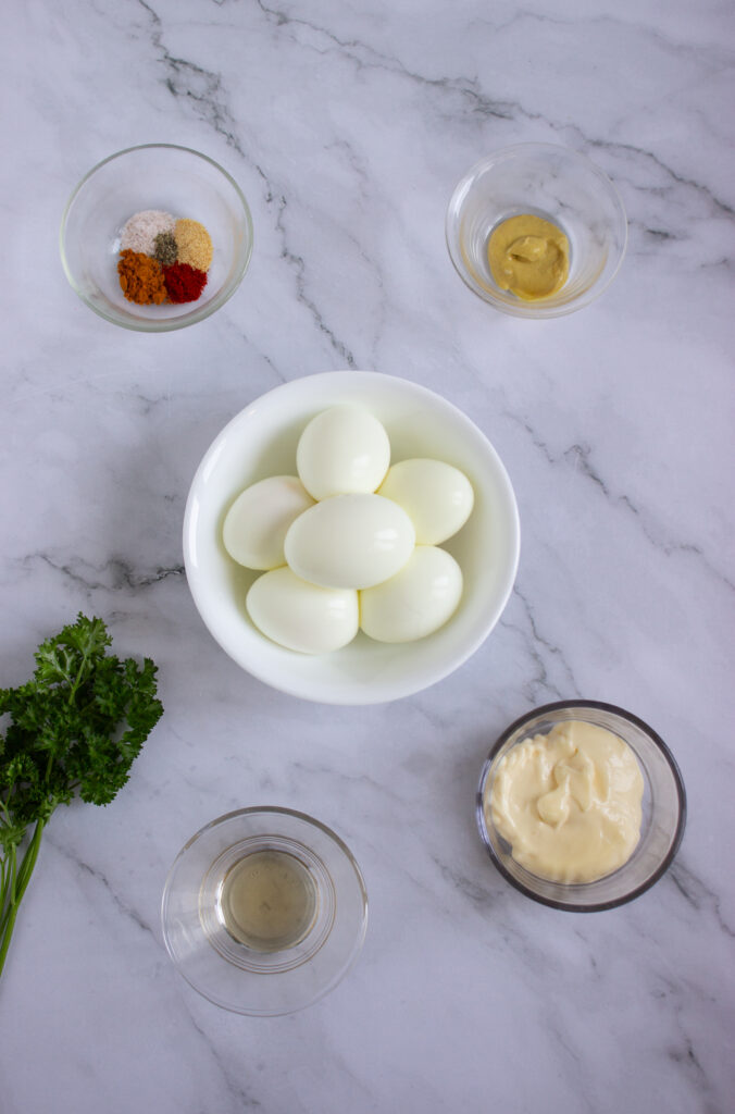 A picture of ingredients needed to make pumpkin deviled eggs.