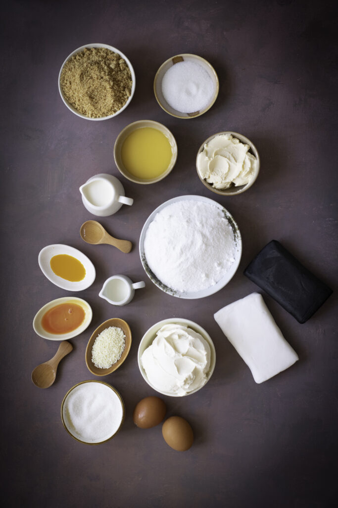 A picture of ingredients needed to make halloween mini cheesecakes.