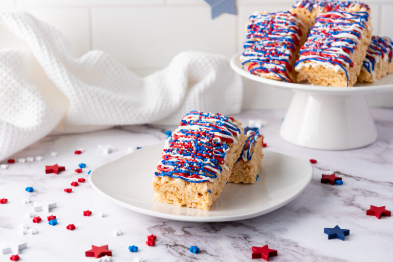 A picture of rice krispy treats covered with red, white, and blue candy icing.
