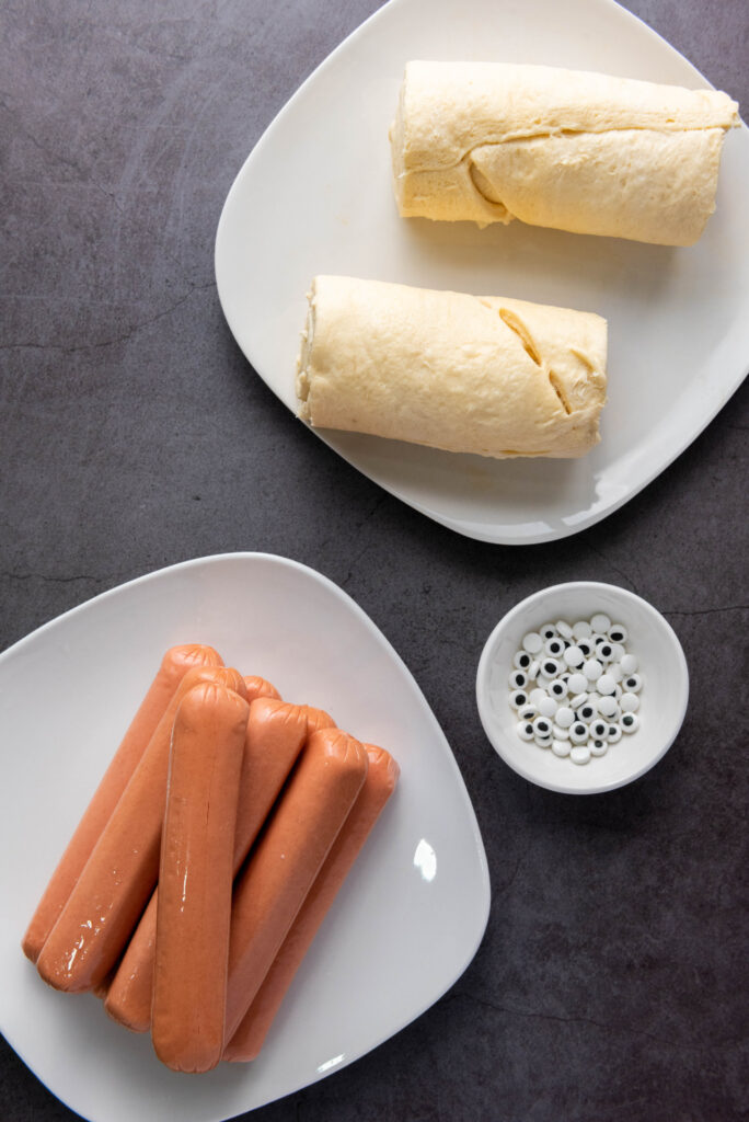 A picture of ingredients needed to make air fryer Halloween mummy dogs.