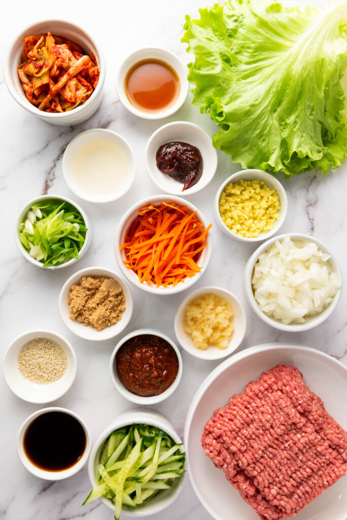 A picture of ingredients needed to make korean beef lettuce wraps.