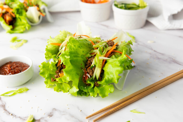 A picture of a korean beef lettuce wrap.