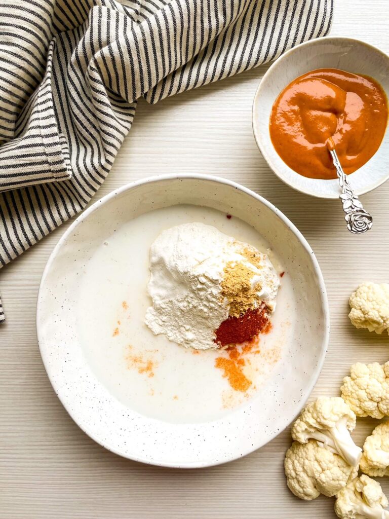 A picture of ingredients to make buffalo sauce in a bowl, unmixed.