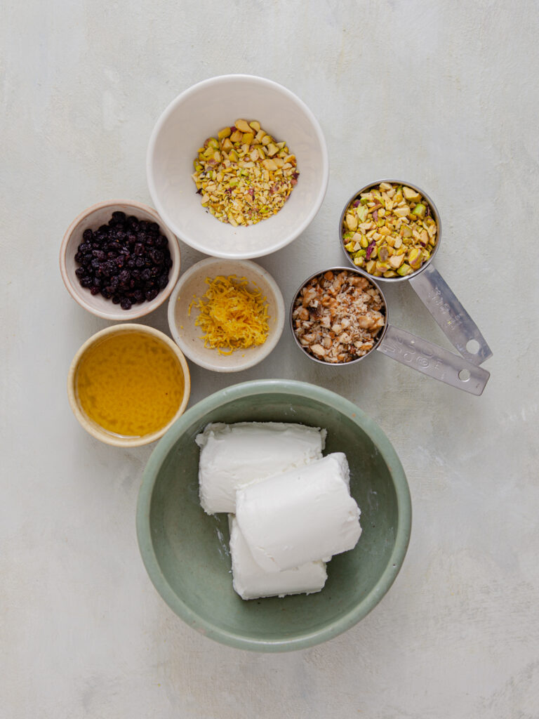 A picture of ingredients needed to make a pistachio black currant cheese log.