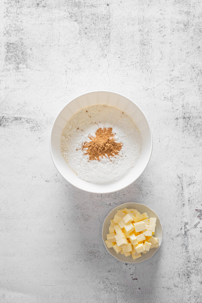 A picture of flour and pumpkin pie spice together in a bowl.