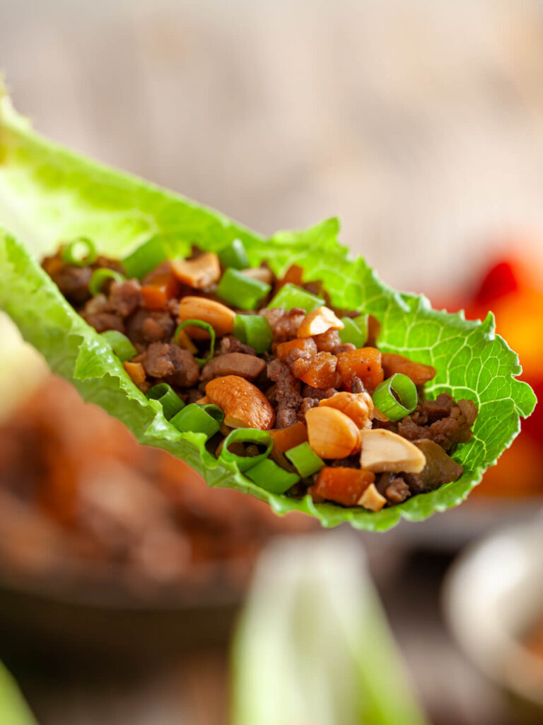 A close up picture of a single chinese pork letuce wrap.