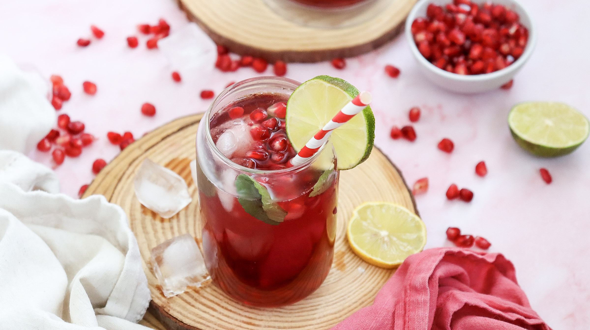 A picture of a mason jar filled with virgin pomegrante fizz.