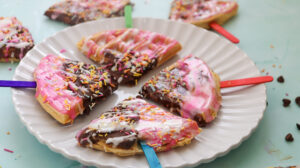 A picture of four waffle pops on a plate.