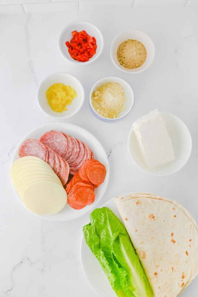 A picture of ingredients needed to make italian pinwheel sandwiches.