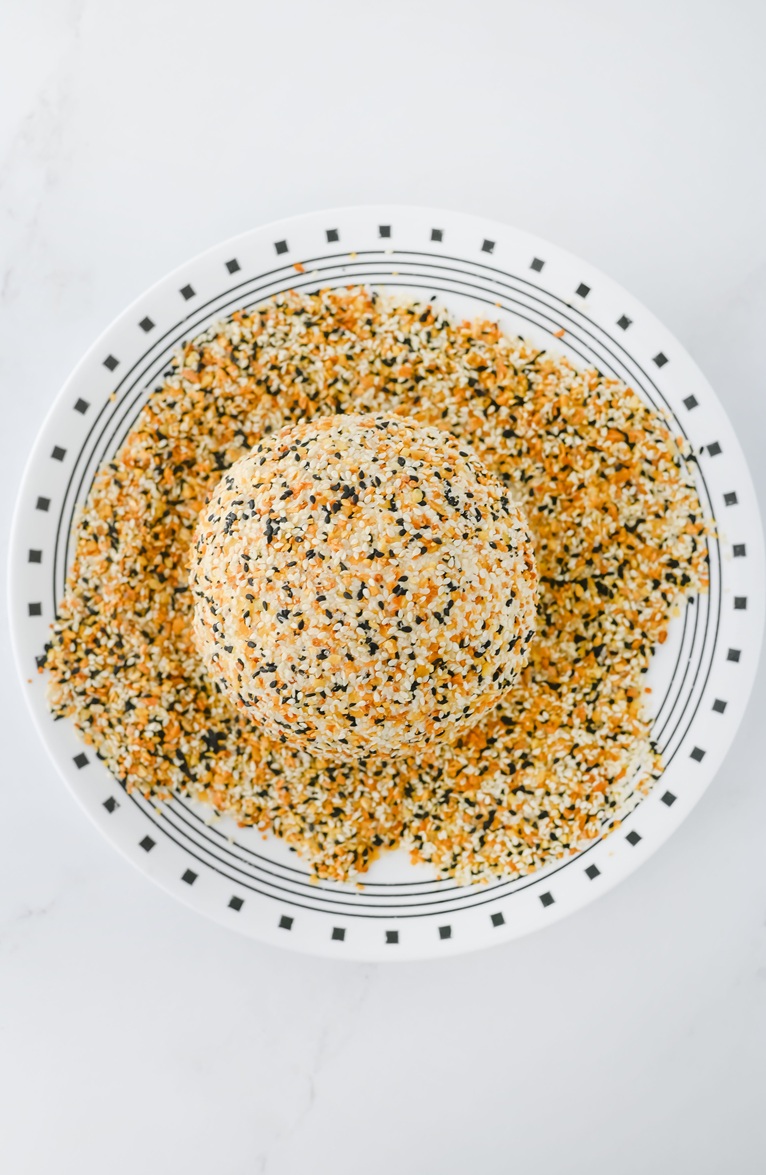 pour bagel seasoning and roll